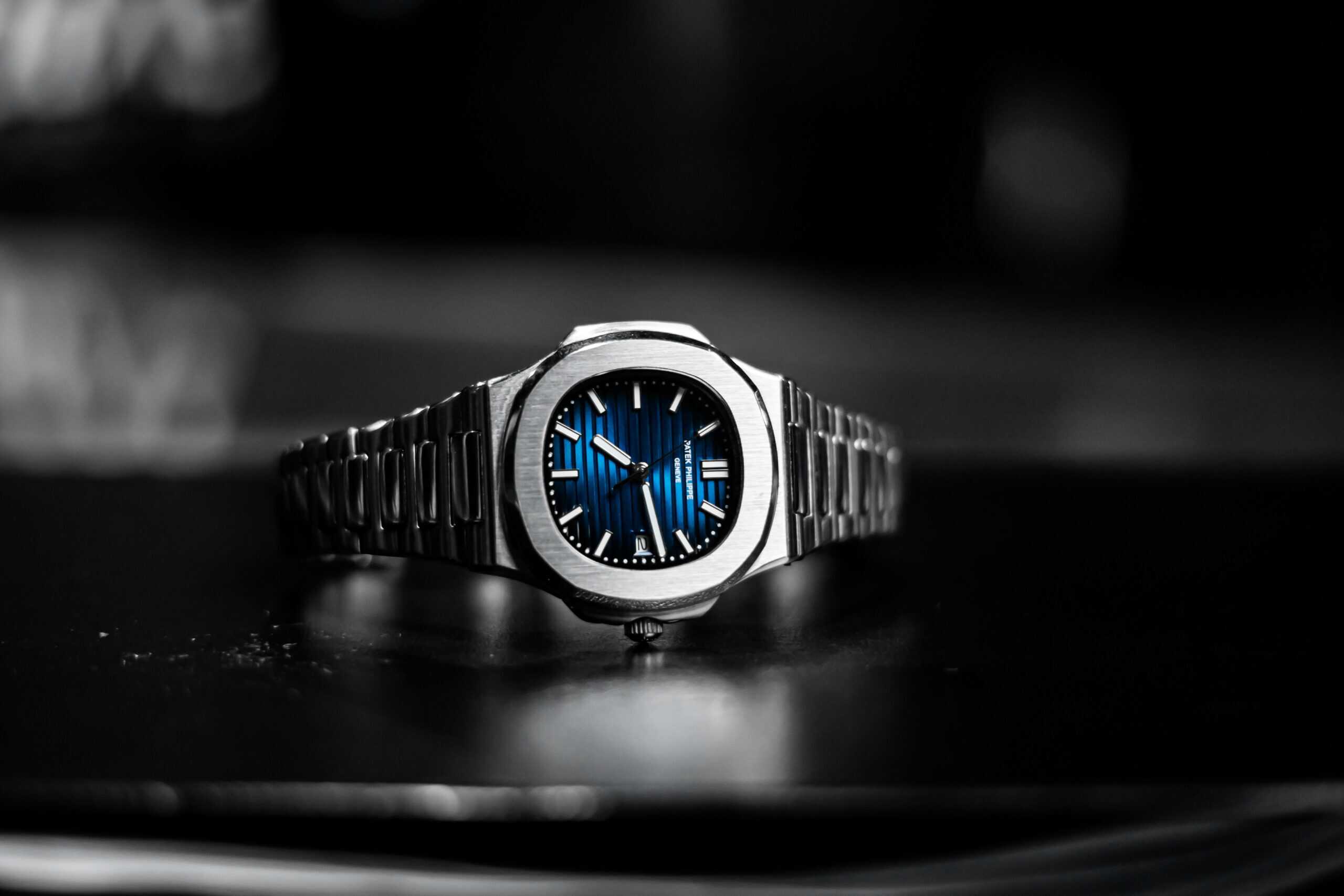 Collectors showcasing vintage Patek Philippe watch models like the Ref. 3414